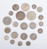 A good collection of silver world coins and tokens to include US quarter dollar, Victorian Rupee,