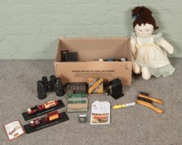 A large box of collectables. Includes Zenith binoculars, Atlas Editions diecast models, The