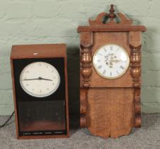 Two wall clocks to include cased Smiths Electric example.