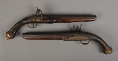 A pair of reproduction flint lock duelling pistols. CANNOT POST OVERSEAS.