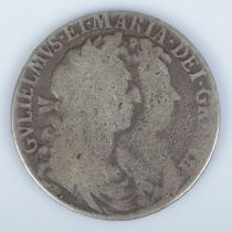 A 1689 William and Mary silver half crown. Total weight 13.9g.