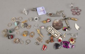 A collection of rings and pendants, approximately 30 pendants and 20 rings.