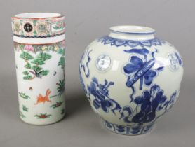 Two Chinese porcelain vases. Includes hand painted sleeve vase and a blue & white example. Both with