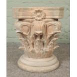 An extensively carved wooden pedestal plinth, with turned stepped base. Height: 46cm, Width: 44cm.