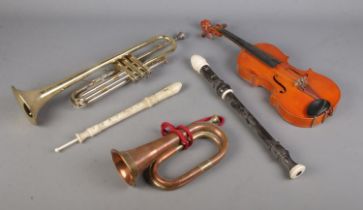 A collection of musical instruments to include copper hunting horn, two recorders, Stentor student