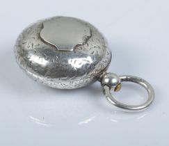 A silver sovereign case, with loop handle, blank shield crest and scrolled detailing. Assayed for