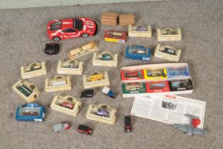 A box of assorted diecast vehicles to include New Bright Remote Control Ferrari, Days Gone, Lledo,