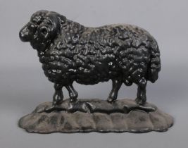 A cast iron doorstop formed as a ram. Approx. height 17.5cm.