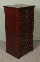A French style mahogany semainier featuring scroll molding and gilt handles. Approx. dimensions 58cm
