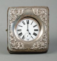 A white metal cased goliath open face pocket watch in a silver mounted watch case with easel back.
