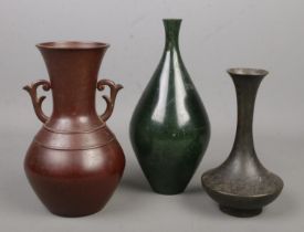 Three Chinese bronze vases, all bearing marks to base. Tallest 24cm.