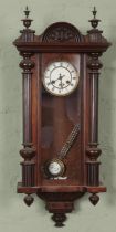 A carved mahogany Junghans 8 day wall clock.