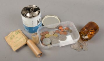 A collection of British and world coins and tokens. Includes National Transport Tokens, Elizabeth II