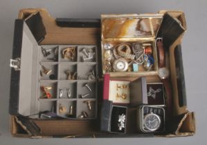 A box of jewellery. Includes Cardinal pocket watch, wristwatches, cuff links, brooches, etc.