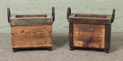 A near pair of miniature log/kindling baskets with metal surrounds.