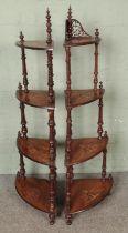 A near pair of walnut inlaid four tier whatnots Hx148cm approx