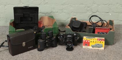 Two boxes of assorted items, to include Escort Radar reciever, Vanguards Minolta binoculars, Zenit