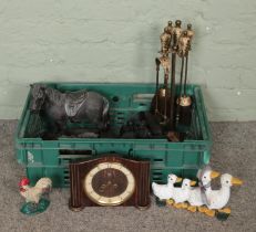 A box of miscellaneous. Includes novelty cast iron door stops, horse figures, coal figures,