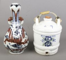 A Chinese porcelain blue & white water vessel along with a Chinese baluster shaped vase with