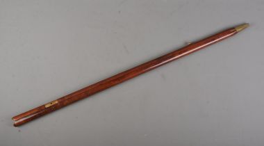 A brass mounted military pace stick.