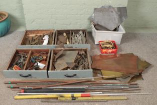 A very large collection of metalwares and tools. To include sheet metal, hammers, tap and dye sets