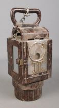 A German WWII bakelite carbide lantern featuring blackout lens and partial swastika mark to reverse.