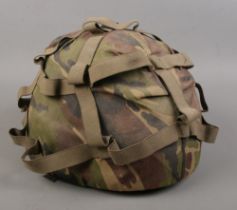 A modern military camouflaged helmet.