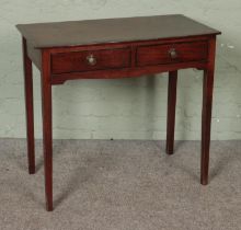 A Georgian Mahogany side table having two short drawers with brass ring pull handles. Hx75cm