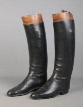 A pair of vintage black leather riding boots, with three section shoe trees. Height: 45cm. Missing