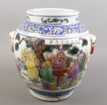 A Chinese hand painted twin handle vessel. Decorated with figures and blue & white fish to the