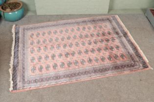 A large silk pink ground rug with Bokhara design. 240cmx170cm.