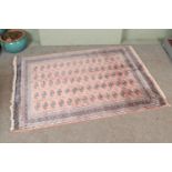 A large silk pink ground rug with Bokhara design. 240cmx170cm.