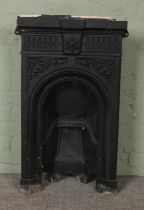 A Victorian painted cast iron fire place.