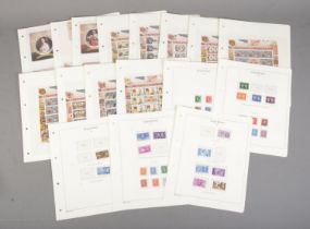 A collection of Coronation commemorative stamp sheets and first day covers to include Ascension