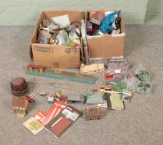 Two boxes of assorted model railway buildings, scenery and diorama supplies to include
