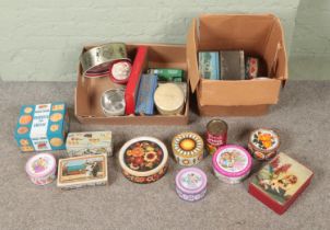 Two boxes of assorted collectors tins to include Cadbury's, biscuit and chocolate examples.