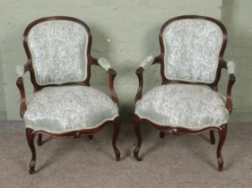 A pair of French style open arm salon chairs