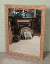 A large gilt framed wall mirror 91x117cm