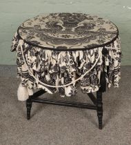 An ebonised aesthetic style window table with fabric top. Hx64cm Dx61cm