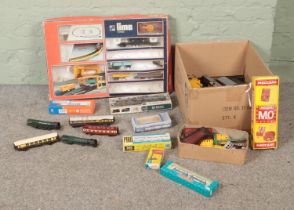 A box of assorted model railway rolling stock and small selection of Meccano to include Fleischmann,