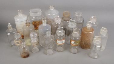 A collection of late 19th/early 20th century apothecary and chemist bottles. Some examples having