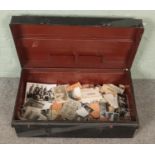 A tin trunk of vintage monochrome photographs. Includes some military examples, etc.