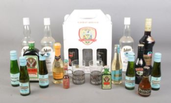 A collection of assorted sealed alcohol, to include three bottles of Bikini white rum, Cherry