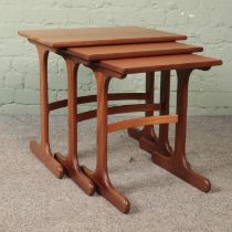 A nest of three teak tables, in the G-Plan Fresco style.