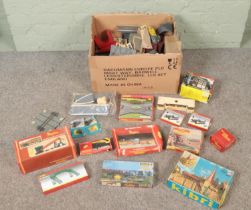 A box of mostly boxed railway accessories and buildings. Includes Hornby, Tri Ang, Kibri, Faller,