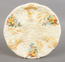 A Clarice Cliff 'Celtic Harvest' pattern plate. Approx. diameter 22.5cm.