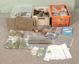 Three boxes of assorted model railway buildings, scenery and diorama supplies to include Tri-Ang,