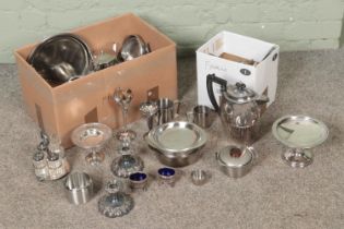 Two boxes of assorted silver plate to include cutlery, tea service, trays, cruet set, etc.