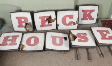 A 1960's illuminating sign from The Peck House Rotherham, Peck House was the former head office