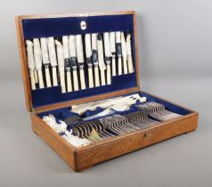 An oak cased Mappin and Webb eight place canteen of cutlery, containing Mappin and Webb flatware.